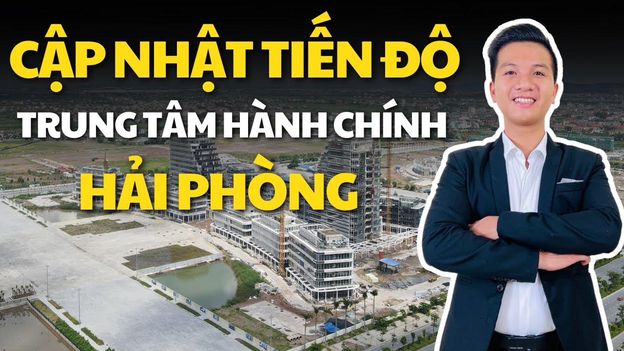 Ảnh flycam công trường Trung tâm Chính trị Hành chính Bắc sông Cấm với các toà nhà đang xây, phía góc là người dẫn video mặc vest